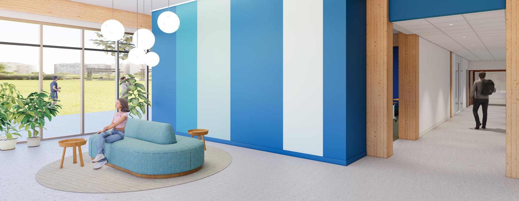 a person sitting on a couch in a room with a blue wall